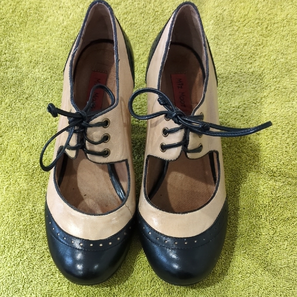 Miz Mooz Black and Tan Leather Lace-Up Booties.